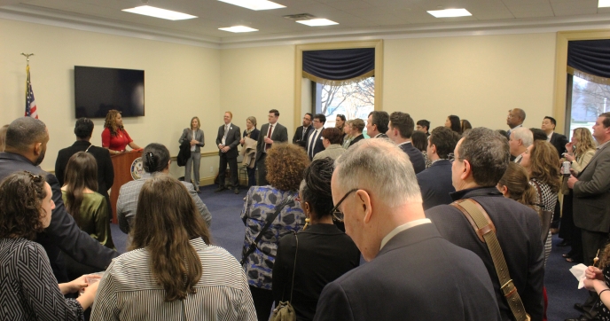 A crowd gathers to hear introductory remarks from Akilah Watkins, the President and CEO of Independent Sector